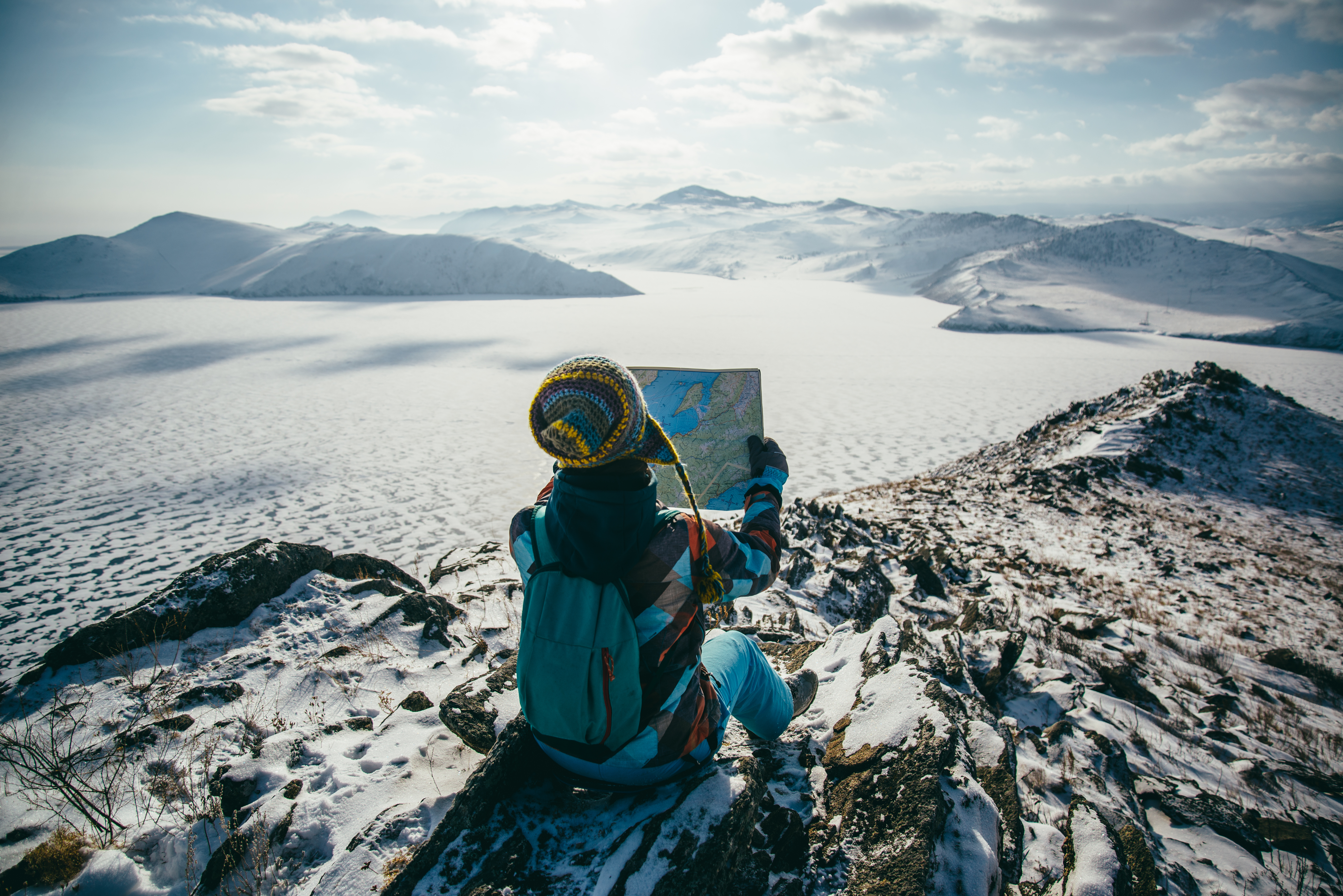 sitting_down_and_studying_a_map_overlooking_a_frozen_landscape-scopio-2afa2391-c336-41c0-8d4c-7a2d2cdea3bd